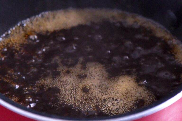 Bring water and prune juice to a boil.