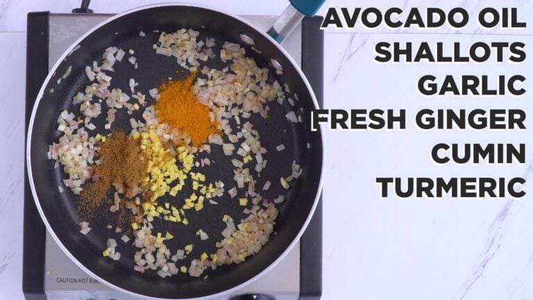 Adding ginger, cumin, and turmeric to the pan.