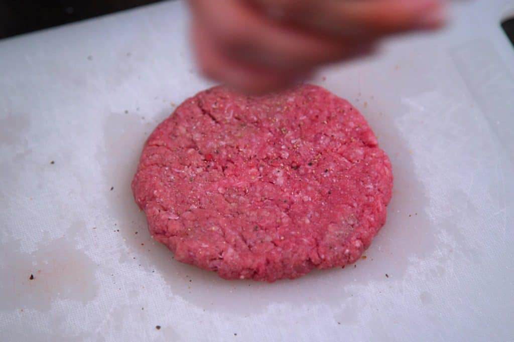 Shape ground beef into 4 patties and season with salt and pepper.