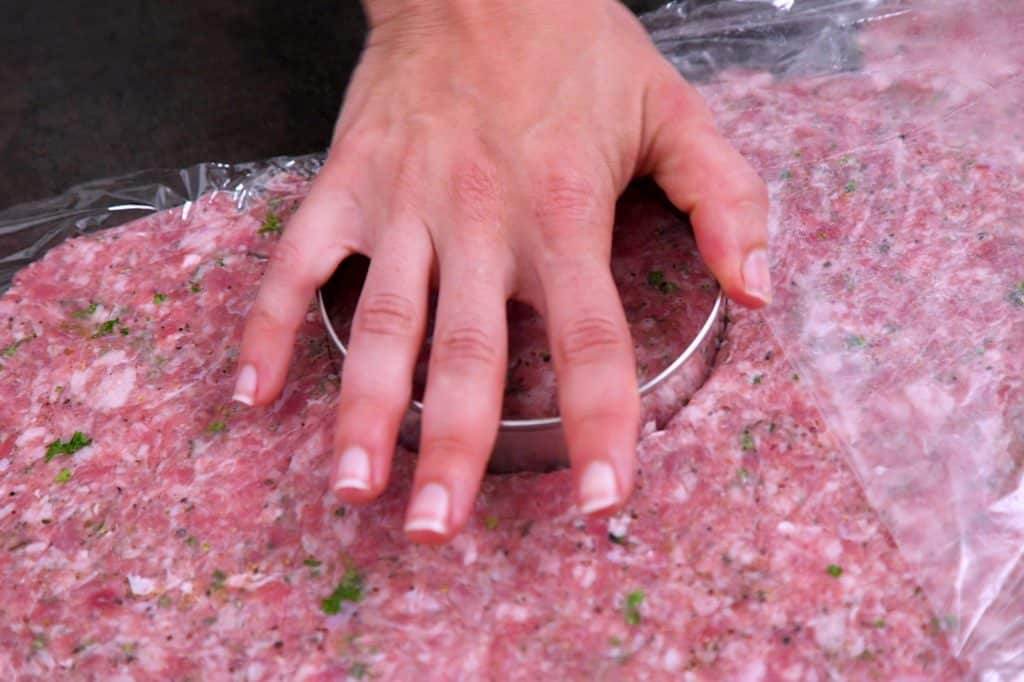 Cut rolled sausage into round patties
