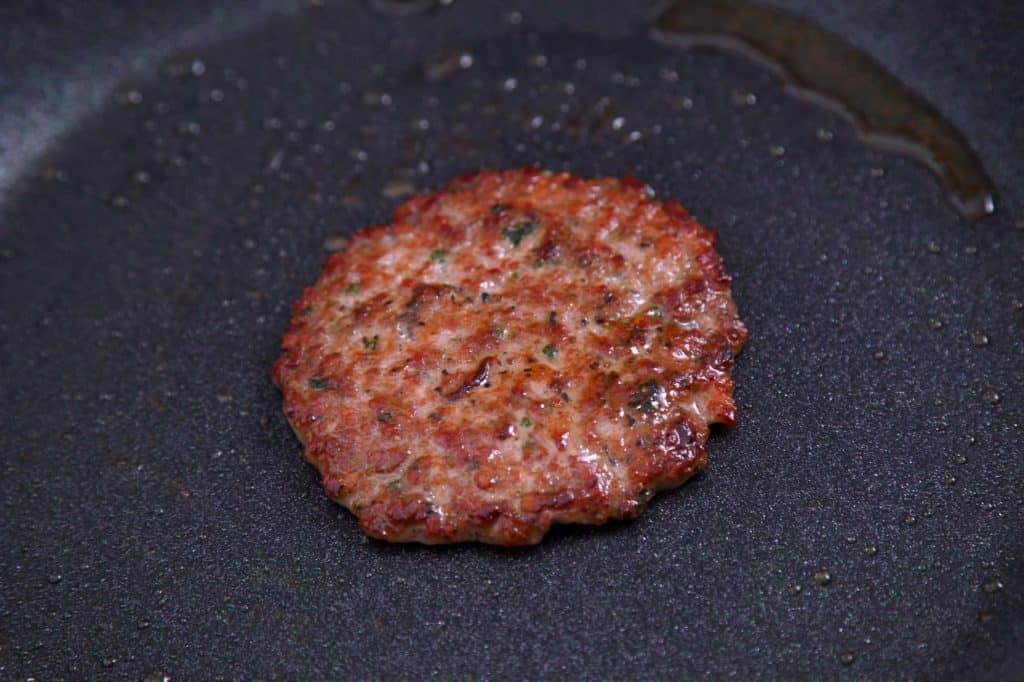 Cook breakfast sausage patties, flattening with spatula as you cook