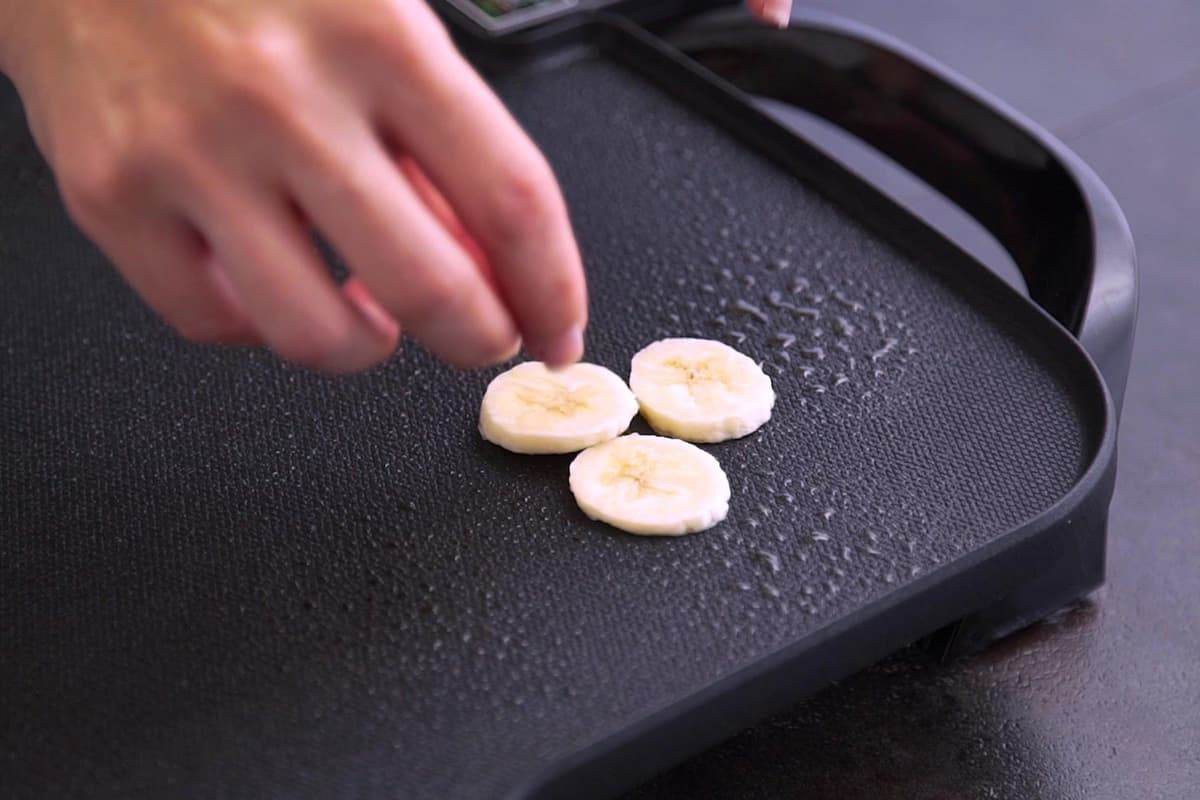 To make coconut banana pancakes, place banana slices directly onto preheated griddle or pan.