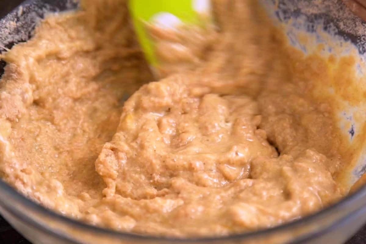 Fold dry mixture into wet mixture until integrated, without overmixing.