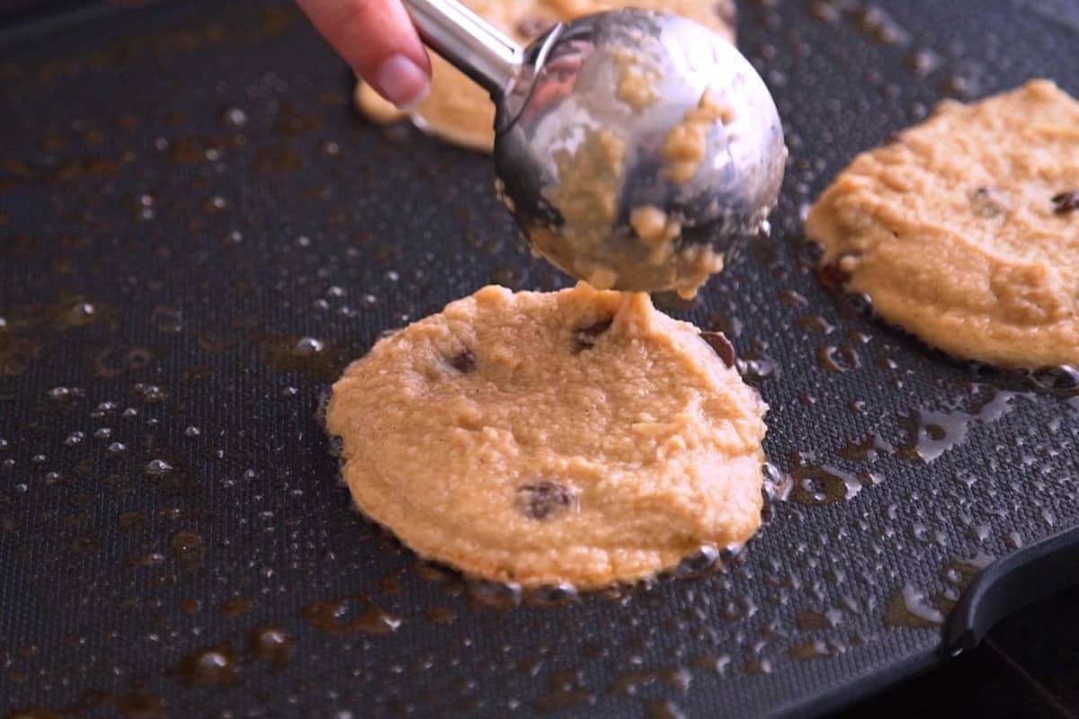 Preheat griddle or pan and grease with butter or oil. Scoop keto pancake batter onto heated surface.