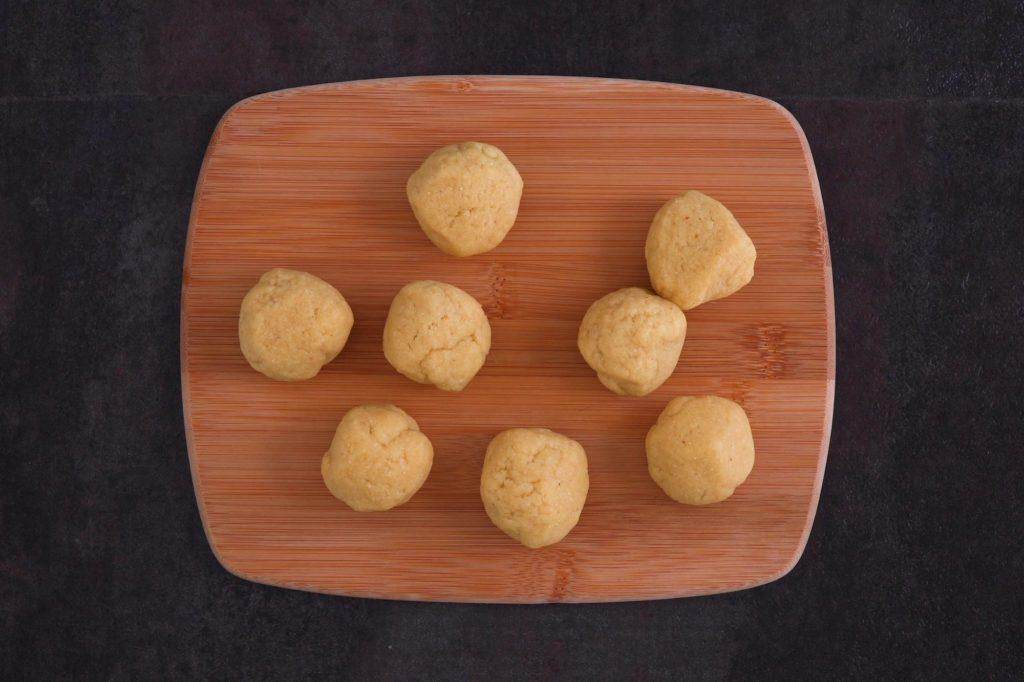 Split dough into 8 even pieces to press.