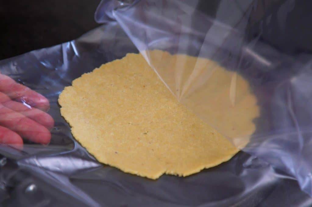 Press each tortilla firmly, not too hard, until flattened. Carefully peel away from plastic sheets.