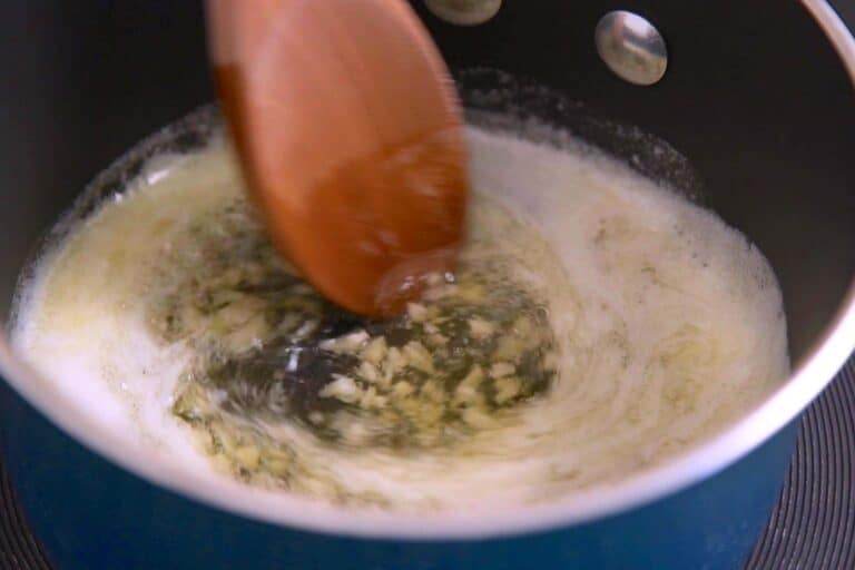 Cook garlic 1-2 minutes, until beginning to brown.