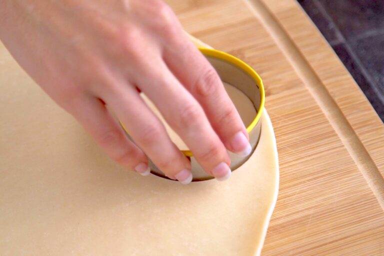 Unroll refrigerated pie dough and use a 3 to 3½-inch cookie cutter to cut out mini pie crusts.