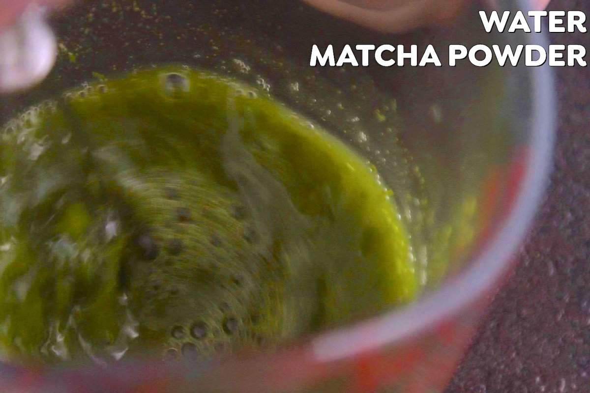 How to Make Matcha Milk Tea: Whisk matcha powder into warm water, until a frothy layer forms with small bubbles.