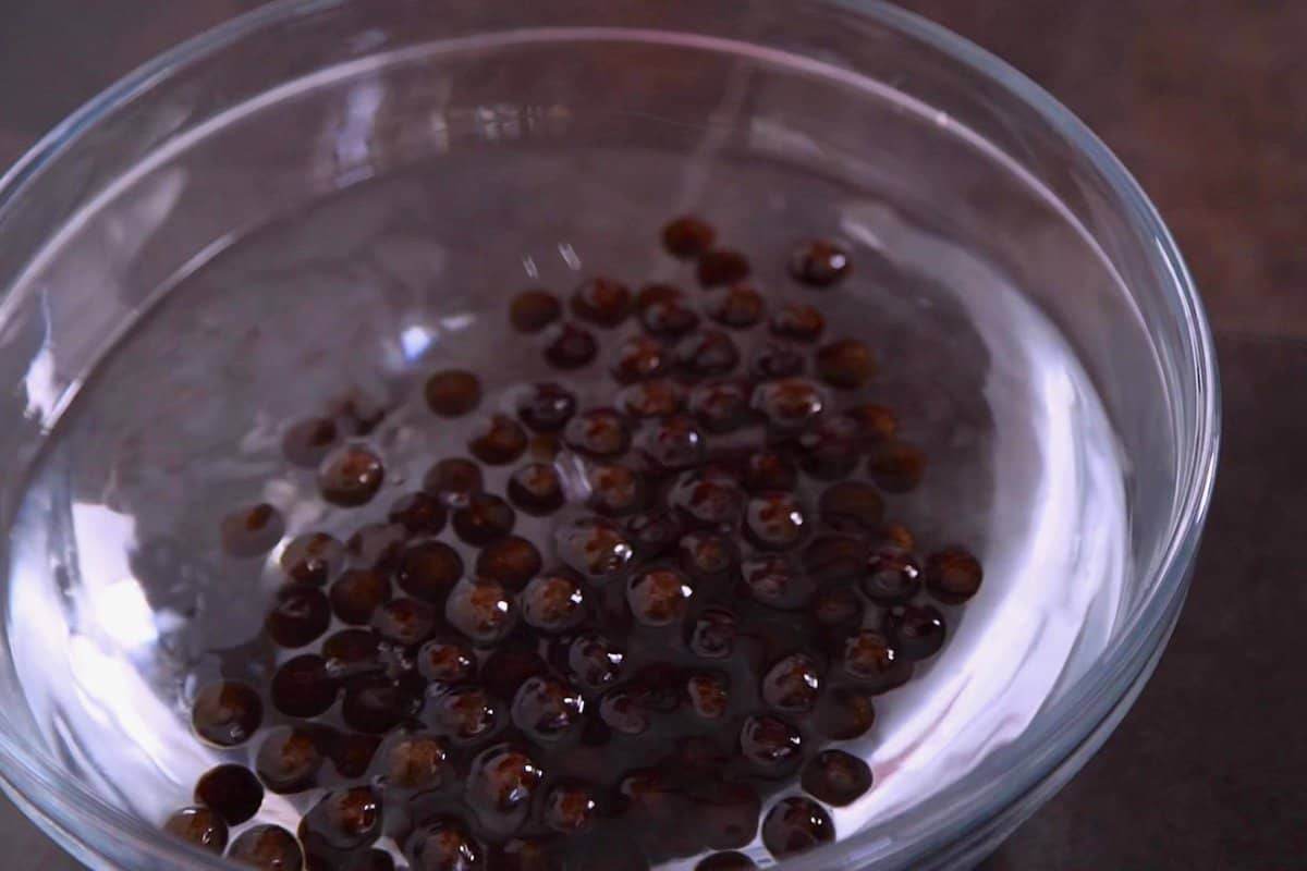 Remove cooked boba with a slotted spoon and transfer to a bowl of cold water until ready to use.