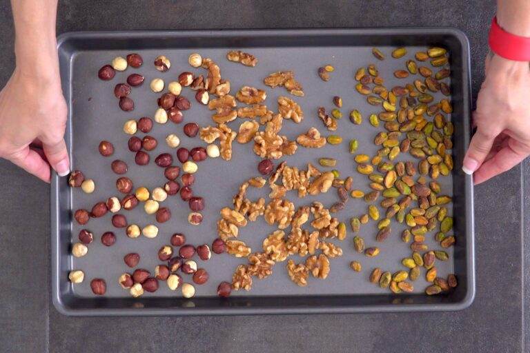 First, toast nuts for 8-10 minutes, until golden and fragrant. Allow to cool slightly before making the nut filling.