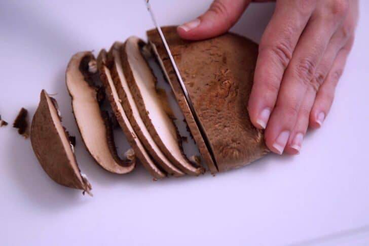 Remove stems and slice portobello mushrooms around 1/8-inch thick.