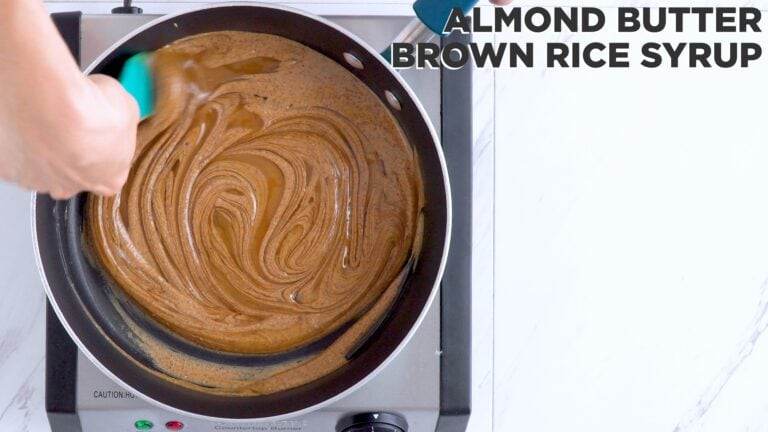 mixing almond butter and brown rice syrup to use as a binder to replace marshmallows in this cereal bar recipe