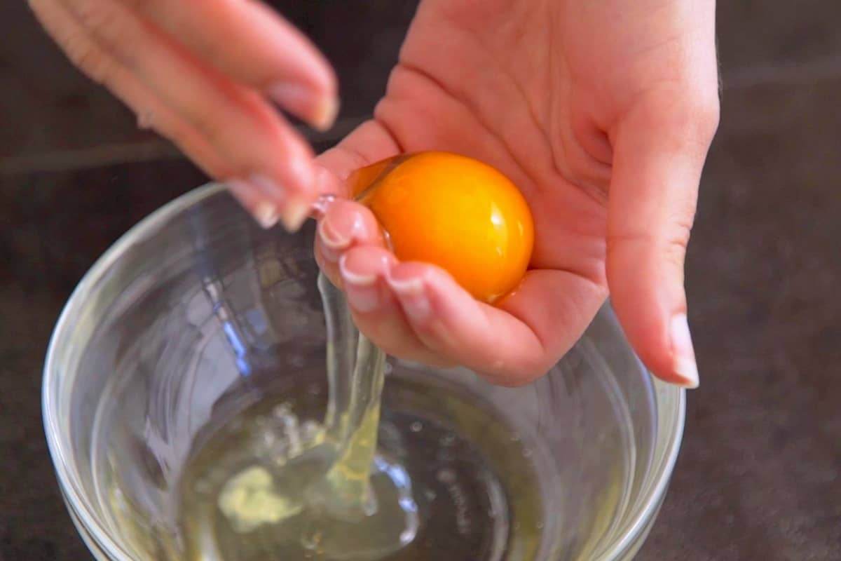 Carefully separate egg yolks from egg whites into different bowls.
