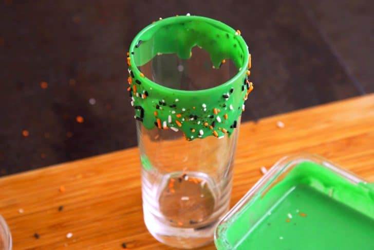 Add festive sprinkles onto frosting while it's still wet, then stand glass upright for a few minutes to give frosting a natural drip effect. Chill in the fridge to set.