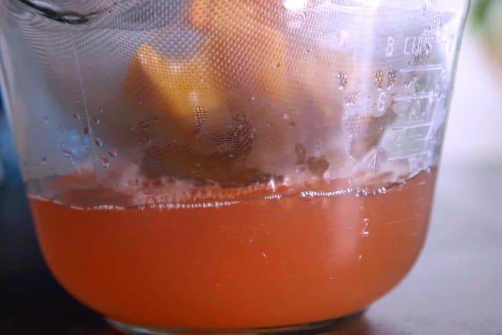 Strain liquid to separate from peaches and allow tea to cool.