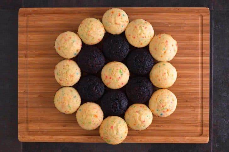 Arrange cooled cupcakes in a circle to form the shape of your web.