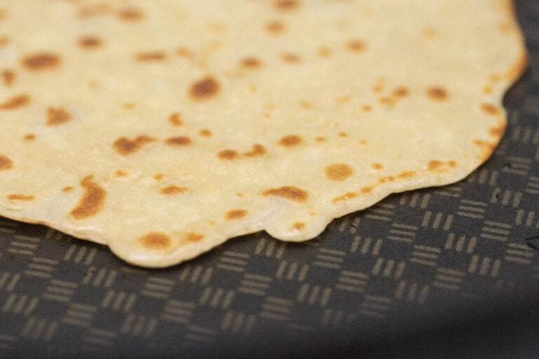 close up of quinoa tortilla cooking in pan