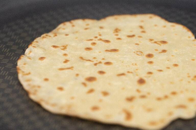 a delicious shot of a fully cooked quinoa tortilla in the pan