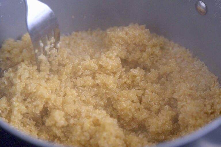 Season to taste and fluff cooked quinoa with a fork before serving.