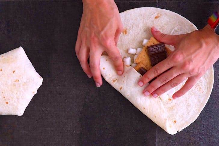 Fold in the edges of the tortilla towards the center.