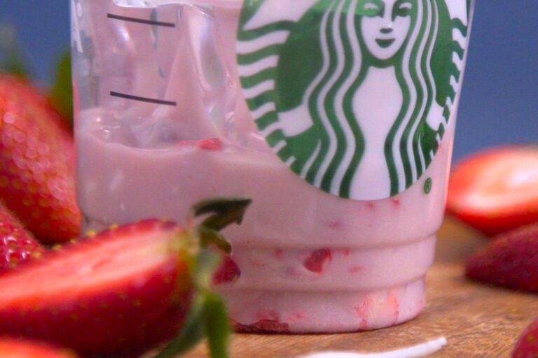 Serve homemade Pink Drink in 2 glasses with freeze-dried strawberries & ice.
