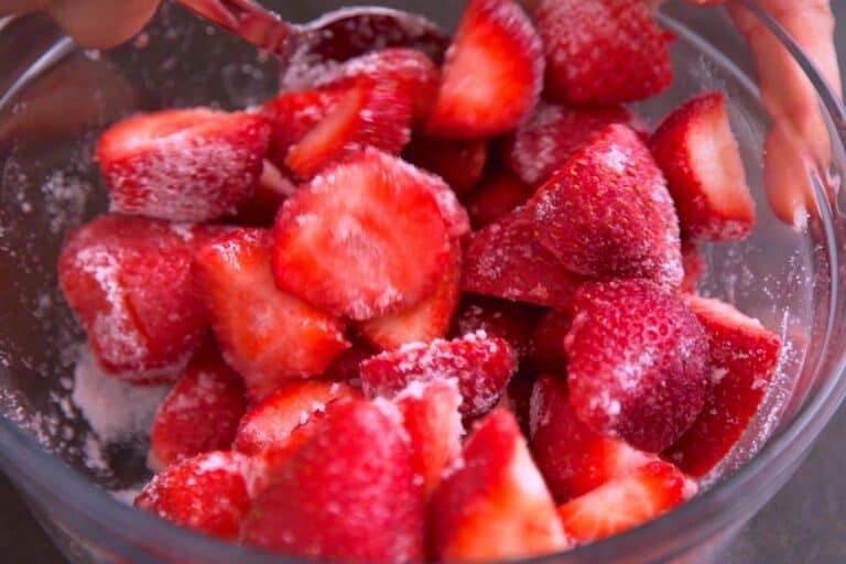 Toss fresh strawberries with granulated sugar to coat.