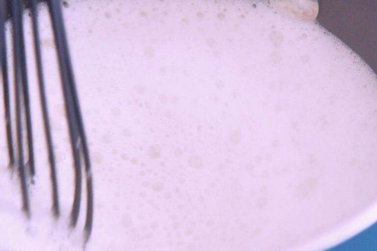 Froth almond milk in a frother, or in a saucepan over the stove, whisking vigorously. (You can do this for a hot latte or an iced latte! Just let the frothed milk cool slightly before assembling your iced latte.)