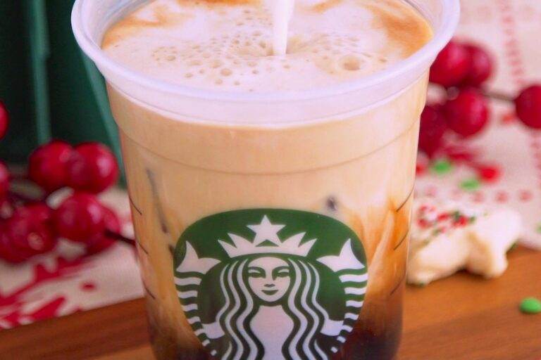 Combine espresso and sugar cookie "syrup" in a serving glass over ice (or skip the ice for a hot latte). Then add frothed milk and top with sprinkles.