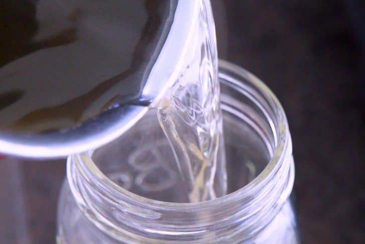 Transfer homemade sugar free simple syrup to a jar to store.