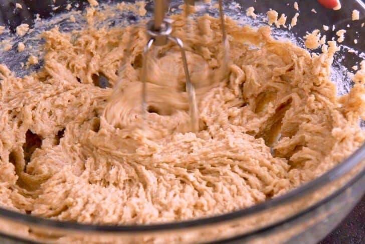 Cream together softened butter and sugars with a hand mixer.