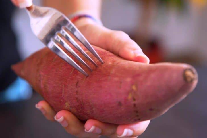 Pierce washed and dried sweet potatoes on all sides with a fork.