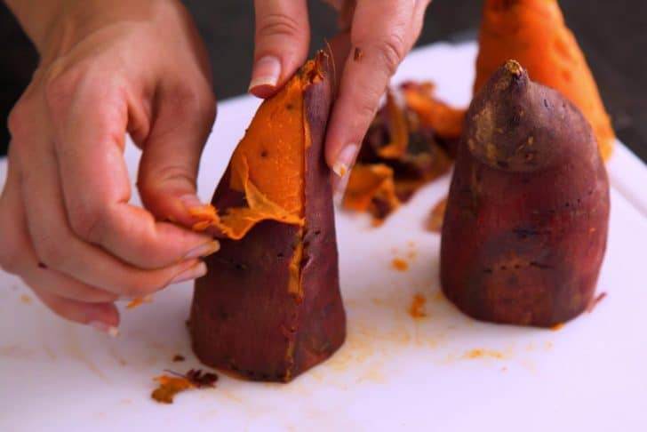 When cool to the touch, peel skin and transfer sweet potato flesh to a food processor.