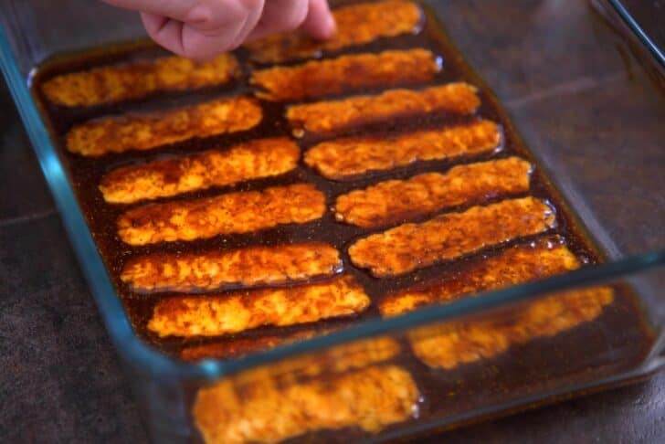 Pour marinade into a flat shallow dish and add tempeh strips, flipping to coat on both sides.
