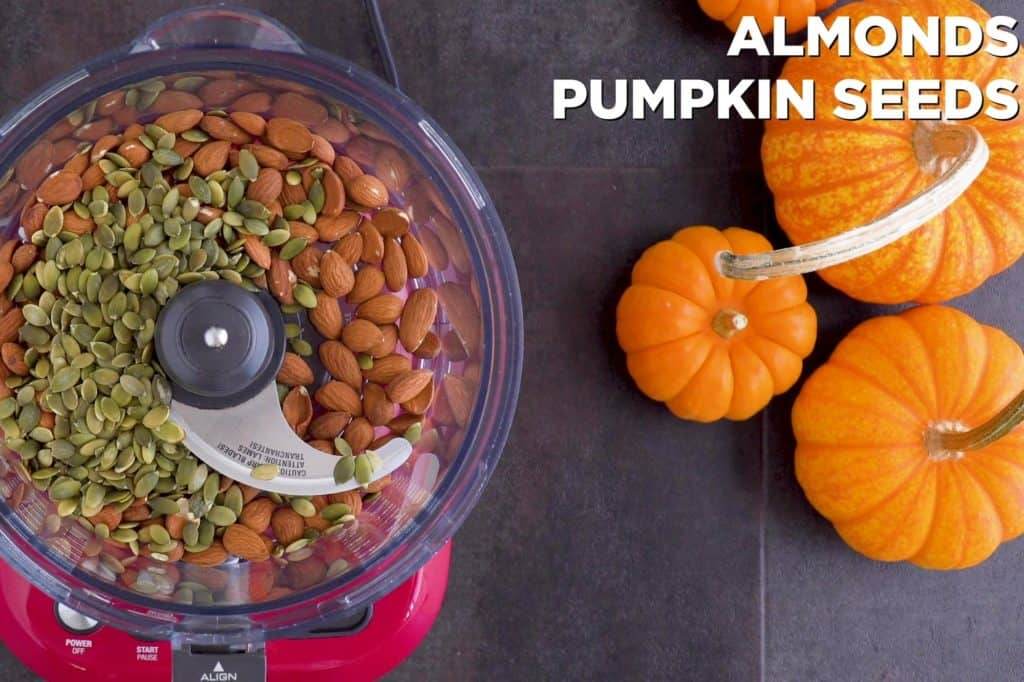 Pulse almonds and pumpkin seeds in food processor until finely chopped.