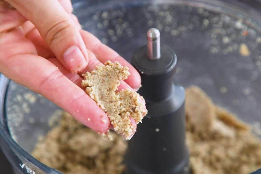Low carb pie crust dough should be sticky and hold together when pressed.