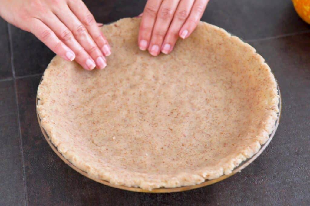 Press low carb pumpkin pie crust into 9-inch pie plate